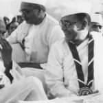 Members of the Indian National Congress (foreground left to right)  Mahatma Gandhi (Mohandas Karamchand Gandhi, 1869 – 1948), Subhas Chandra Bose (1897 – 1945) and Vallabhai Patel (1875-1950) during the 51st Indian National Congress.