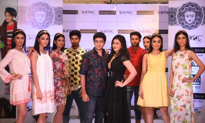Gaurav Chakrabarty and Riddhima Ghosh pose with models at the Western Wear Fashion Show at Shoppers Stop Sananda Pujor Bazar 2016