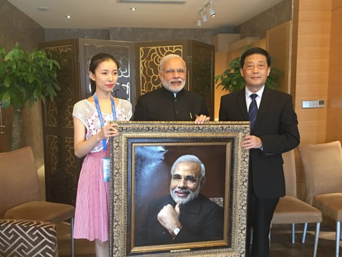 Prime Minister Modi - with his potrait in China