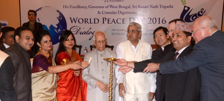 Governor of West Bengal Keshari Nath Tripathi (C) with Consulates in Kolkata USA, China, Germany, Nepal & others also lighting "Peace Lamp" during "World Peace Day"