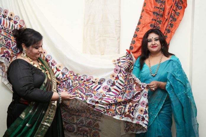 Kuheli Ray Bhattacharya explains her designs to Riddhi Bandyopadhyay