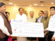 Dividend cheque by the CMD, HUDCO