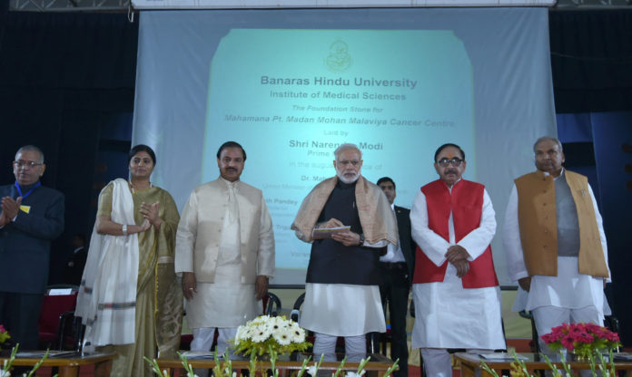 The Prime Minister, Shri Narendra Modi laying the foundation stone of Mahamana Pandit Madan Mohan Malaviya Cancer Centre, at Varanasi, Uttar Pradesh on December 22, 2016. The Minister of State for Culture and Tourism (Independent Charge), Dr. Mahesh Sharma, the Minister of State for Human Resource Development, Dr. Mahendra Nath Pandey and the Minister of State for Health & Family Welfare, Smt. Anupriya Patel are also seen.