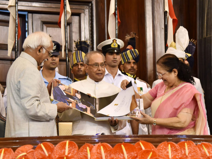 The President, Shri Pranab Mukherjee being presented a coffee-table book by the Vice President and the Chairman, Rajya Sabha, Shri M. Hamid Ansari and the Speaker, Lok Sabha, Smt. Sumitra Mahajan, during his farewell function, at Central Hall of the Parliament, in New Delhi on July 23, 2017.