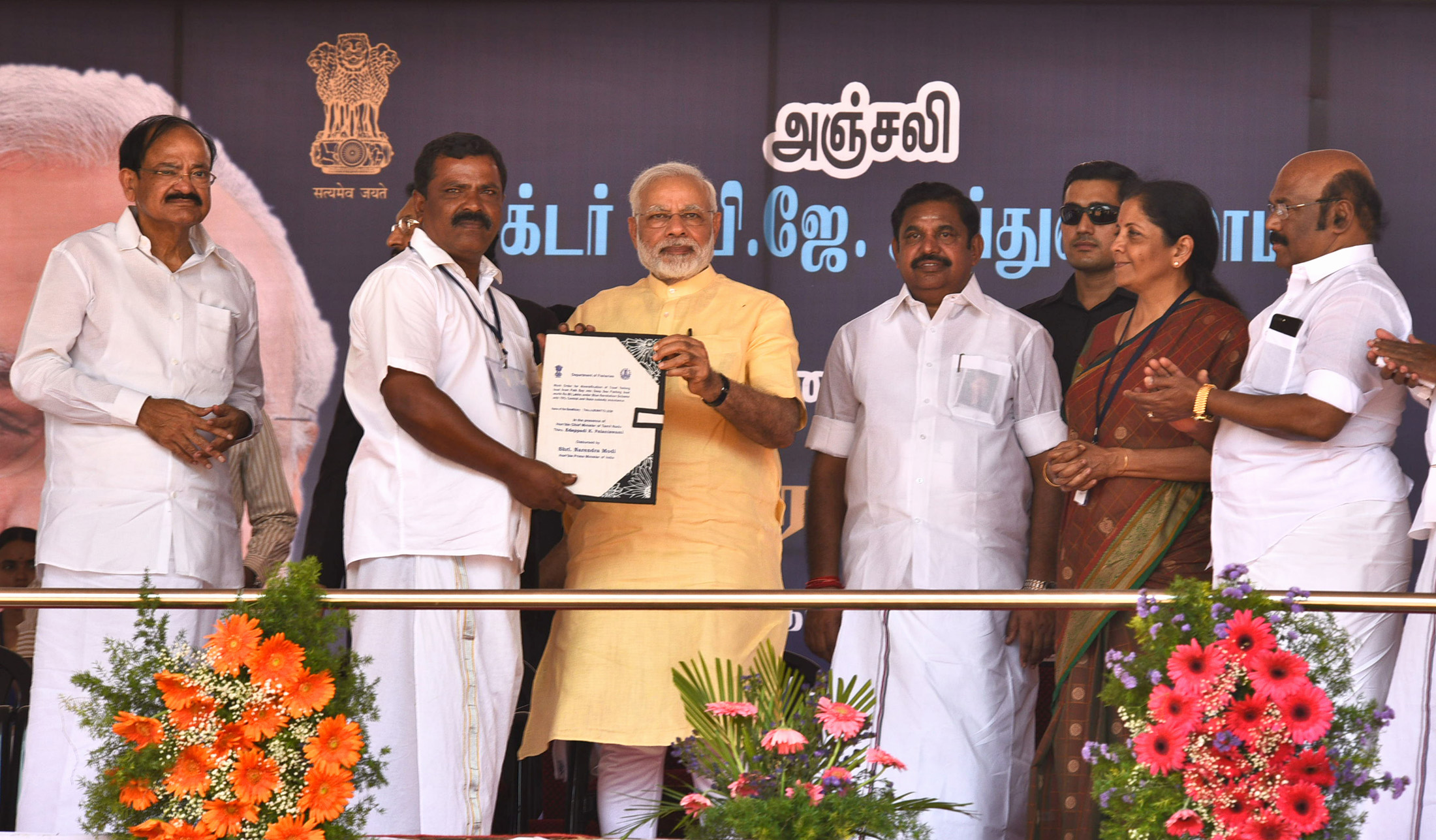 The Prime Minister, Shri Narendra Modi distributing the Sanction Letters to beneficiaries of Long Liner Trawlers under Blue Revolution Scheme, at Rameswaram, Tamil Nadu on July 27, 2017. The Chief Minister of Tamil Nadu, Shri Edappadi K. Palaniswami, the Minister of State for Commerce & Industry (Independent Charge), Smt. Nirmala Sitharaman and other dignitaries are also seen.
