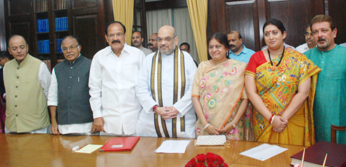 The Vice President and Chairman, Rajya Sabha, Shri M. Venkaiah Naidu with the newly elected Members of Rajya Sabha, Shri Amit Shah and Smt. Smriti Irani, at a Swearing-in Ceremony, at Parliament House, in New Delhi on August 25, 2017. The Deputy Chairman, Rajya Sabha, Shri P.J. Kurien, the Union Minister for Finance, Corporate Affairs and Defence, Shri Arun Jaitley and the Union Minister for Consumer Affairs, Food and Public Distribution, Shri Ram Vilas Paswan are also seen.