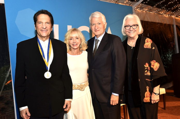 UCLA Medal recipient Peter Guber; Dean Judy Olian of the UCLA Anderson School of Management; UCLA Chancellor Gene Block; Dean Teri Schwartz of the UCLA School of Theater, Film and Television. (PRNewsfoto/UCLA Anderson School of Managem)