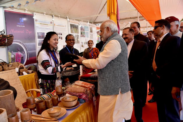 The Prime Minister, Shri Narendra Modi walks through the exhibition of farm produce of North-East and display of relevant farm and non-farm technologies, at Assam Rifles Cant, Aizawl on December 16, 2017. The Minister of State for Development of North Eastern Region (I/C), Prime Minister’s Office, Personnel, Public Grievances &amp; Pensions, Atomic Energy and Space, Dr. Jitendra Singh is also seen.