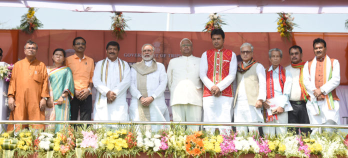 The Prime Minister, Shri Narendra Modi attending the oath taking ceremony of the Council of Ministers of the Tripura Government, in Agartala in Agartala on March 09, 2018. The Governor of Tripura, Shri Tathagata Roy is also seen.
