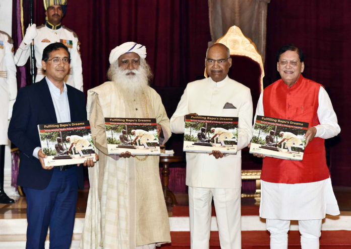 The President, Shri Ram Nath Kovind receiving the first copy of the book Fulfilling Bapus Dreams - Prime Minister Modis Tribute to Gandhiji, at Rashtrapati Bhavan, in New Delhi on March 09, 2018.