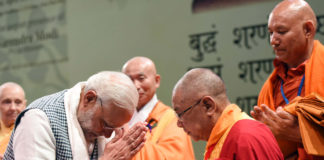 The Prime Minister, Shri Narendra Modi offering Sangh Dana, at the inauguration of Buddha Jayanti Celebrations in New Delhi on April 30, 2018.
