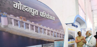PM in Madhya Pradesh: dedicates Mohanpura Irrigation Project to the Nation The Prime Minister, Shri Narendra Modi visiting an exhibition before dedicating the Mohanpura Project to the Nation, in Madhya Pradesh on June 23, 2018. The the Chief Minister of Madhya Pradesh, Shri Shivraj Singh Chouhan is also seen.