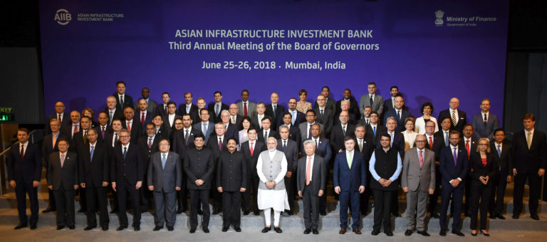 The Prime Minister, Shri Narendra Modi in a group photograph at the Third Annual Meeting of the Asian Infrastructure Investment Bank (AIIB), in Mumbai on June 26, 2018. The Governor of Maharashtra, Shri C. Vidyasagar Rao, the Union Minister for Railways, Coal, Finance and Corporate Affairs, Shri Piyush Goyal, the Chief Minister of Maharashtra, Shri Devendra Fadnavis and other dignitaries are also seen.