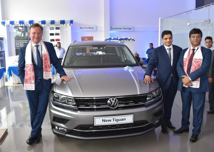 (From L to R) Mr. Steffen Knapp, Director, Volkswagen Passenger Cars along with Mr. Charchit Mishra, Director, OSL Exclusive and Mr. Ashish Gupta, Head of Sales, Volkswagen Passenger Cars unveil the Tiguan at the newly inaugurated dealership, Volkswagen Guwahati