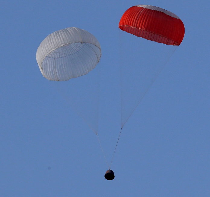 The Crew Module, part the Crew Escape System (CES), floating back to earth under its parachutes over the Bay of Bengal about 2.9 km from the Satish Dhawan Space Centre, Sriharikota, during a test conducted by the Indian Space Research Organisation (ISRO), in Andhra Pradesh on July 05, 2018.