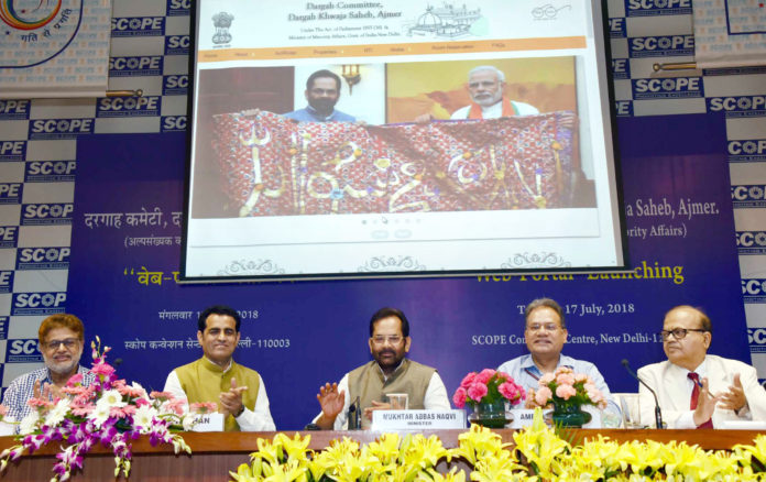 The Union Minister for Minority Affairs, Shri Mukhtar Abbas Naqvi launching the Web-Portal of Dargah Khwaja Saheb, Ajmer, at a function, in New Delhi on July 17, 2018. The Secretary, Ministry of Minority Affairs, Shri Ameising Luikham and other dignitaries are also seen.