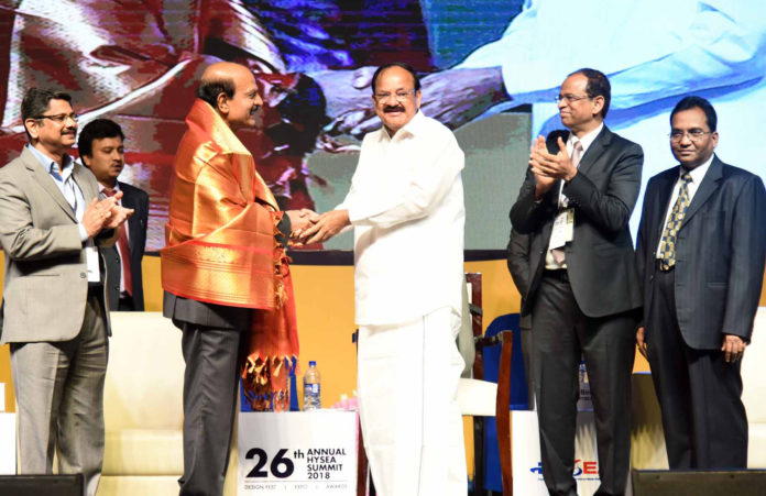 The Vice President, Shri M. Venkaiah Naidu felicitating Shri B.V.R. Mohan Reddy for his exemplary service in the field of IT for over three decades, at the 26th Annual HYSEA Summit 2018, organised by the Hyderabad Software Enterprises Association, in Hyderabad on July 27, 2018.