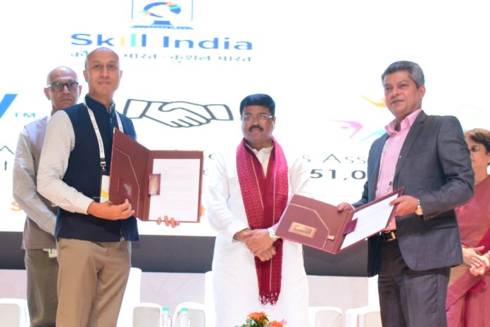 Rajat Banerjee Vice President Corporate Affiars Amway India Jaames A Raphael Execuitive Head RASCI signing the MOU in presence of Dharmendra Pradhan Hon'ble minis