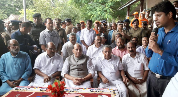 The Union Home Minister, Shri Rajnath Singh being briefed by a local official, during his visit to a flood relief camp, in Kerala on August 12, 2018. The Chief Minister of Kerala, Shri Pinarayi Vijayan and the Minister of State for Tourism (I/C), Shri Alphons Kannanthanam are also seen.
