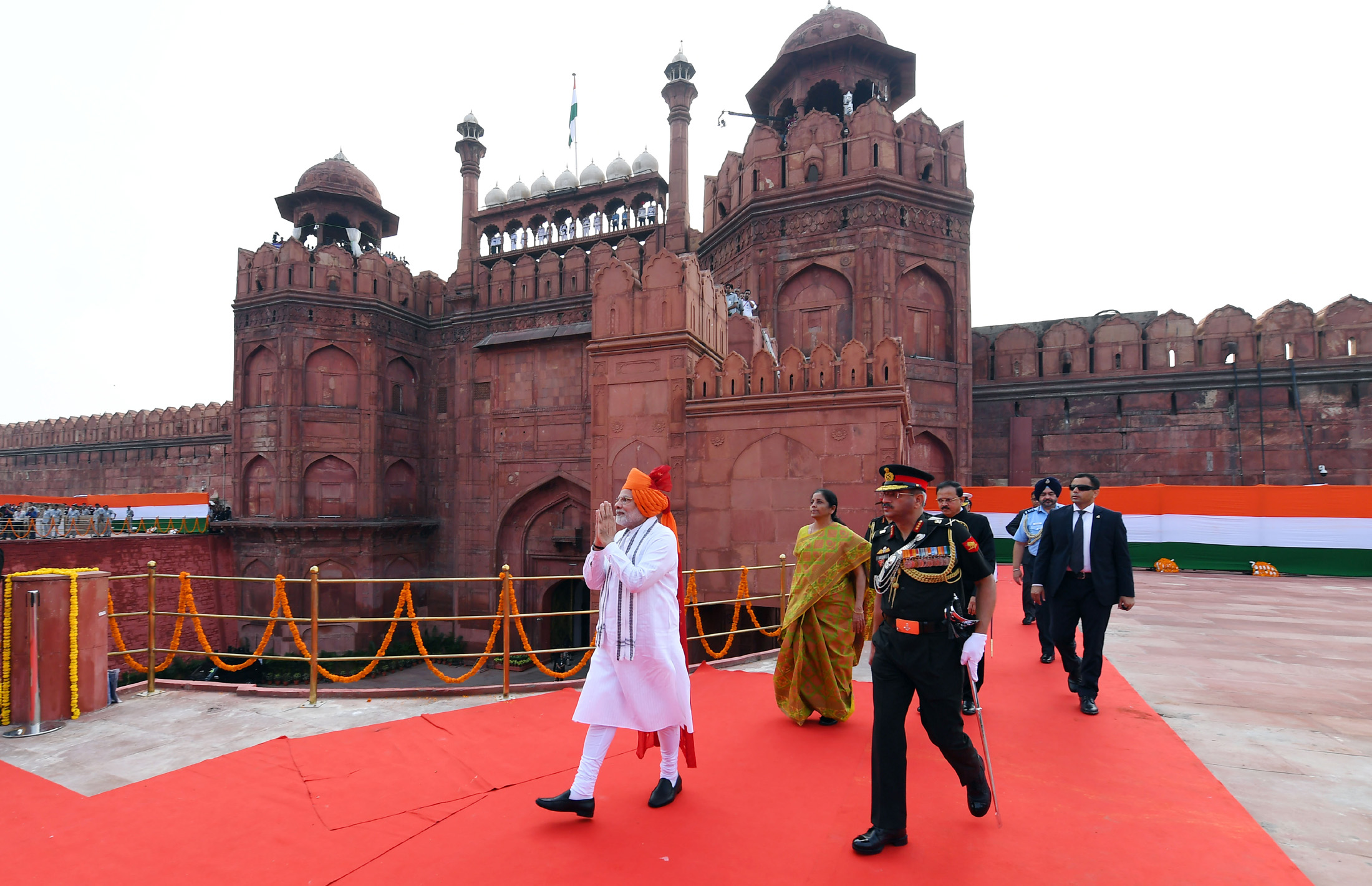 The Prime Minister, Shri Narendra Modi walking towards the dais to address the Nation at the Red Fort, on the occasion of 72nd Independence Day, in Delhi on August 15, 2018. The Union Minister for Defence, Smt. Nirmala Sitharaman and the Minister of State for Defence, Dr. Subhash Ramrao Bhamre are also seen.