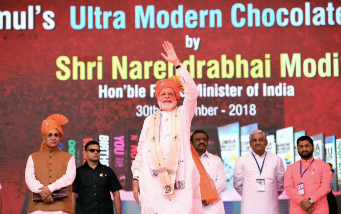 The Prime Minister, Shri Narendra Modi at the inauguration of the Amul’s ultra-modern Chocolate Plant, at Anand, Gujarat on September 30, 2018. The Chief Minister of Gujarat, Shri Vijay Rupani, the Minister of State for Tribal Affairs, Shri Jaswantsinh Sumanbhai Bhabhor and other dignitaries are also seen.