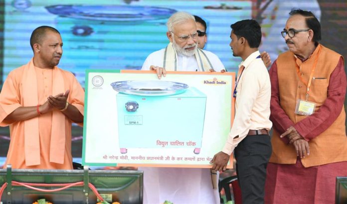 The Prime Minister, Shri Narendra Modi at the inauguration of the various development projects, in Varanasi, Uttar Pradesh on September 18, 2018. The Chief Minister of Uttar Pradesh, Yogi Adityanath is also seen.