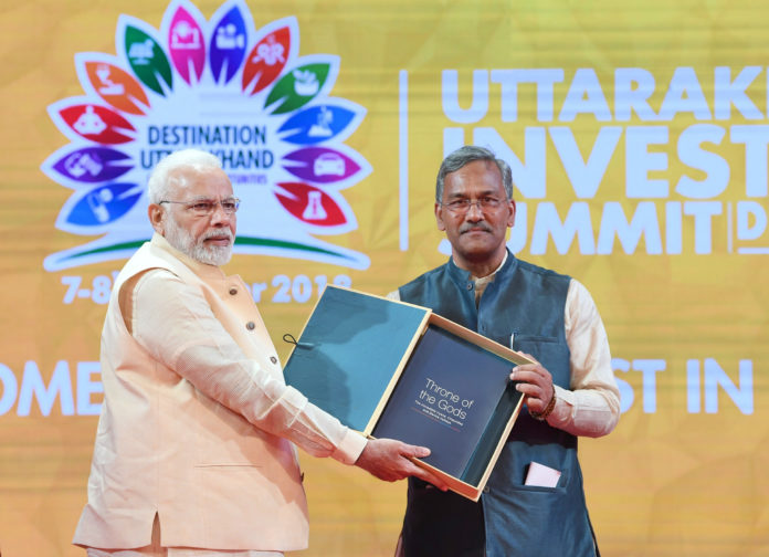 The Prime Minister, Shri Narendra Modi at the 1st Uttarakhand Investors Summit, at Dehradun, Uttarakhand on October 07, 2018. The Chief Minister of Uttarakhand, Shri Trivendra Singh Rawat is also seen.
