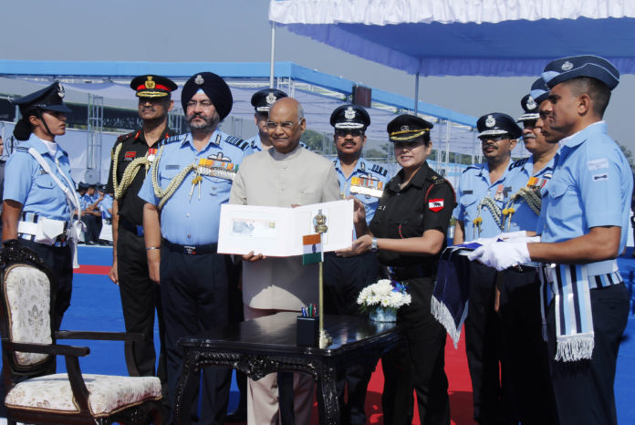 The President and Supreme Commander of the Indian Armed Forces, Shri Ram Nath Kovind releasing the First Day Covers of Air Defence College, at Air Force Station Guwahati on November 29, 2018. The Chief of the Air Staff, Air Chief Marshal B.S. Dhanoa is also seen.