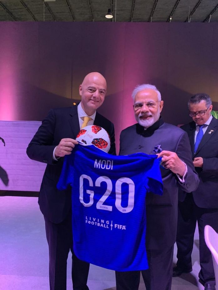 Modi with Football Jersey from FIFA president