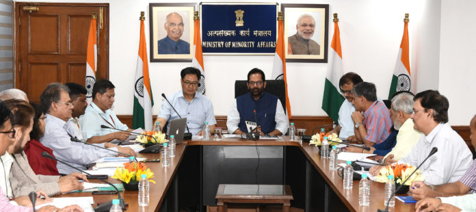 The Union Minister for Minority Affairs, Shri Mukhtar Abbas Naqvi chairing a meeting, in New Delhi on June 04, 2019. The Minister of State for Youth Affairs & Sports (Independent Charge) and Minority Affairs, Shri Kiren Rijiju is also seen.