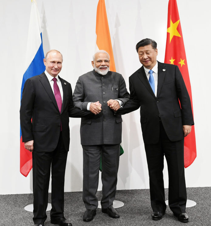 The Prime Minister, Shri Narendra Modi at the informal meeting between Russia, India and China (RIC), on the sidelines of the G-20 Summit, in Osaka, Japan on June 28, 2019.