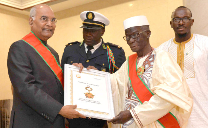 The President, Shri Ram Nath Kovind conferring with the National Order of Merit, the Highest Award of Guinea by the President of the Republic of Guinea, Mr. Alpha Conde, in Conakry, Republic of Guinea on August 02, 2019.