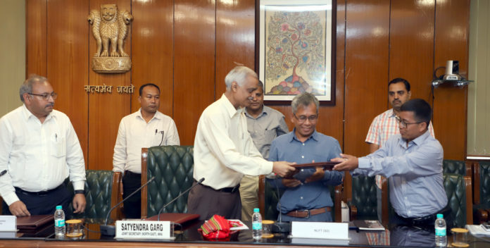 The Joint Secretary (NE) MHA, Shri Styendra Garg exchanging the files with the National Liberatin Front of Twipra (SD) representatives after Signing the Memorandum of settlement, in New Delhi on August 10, 2019.
