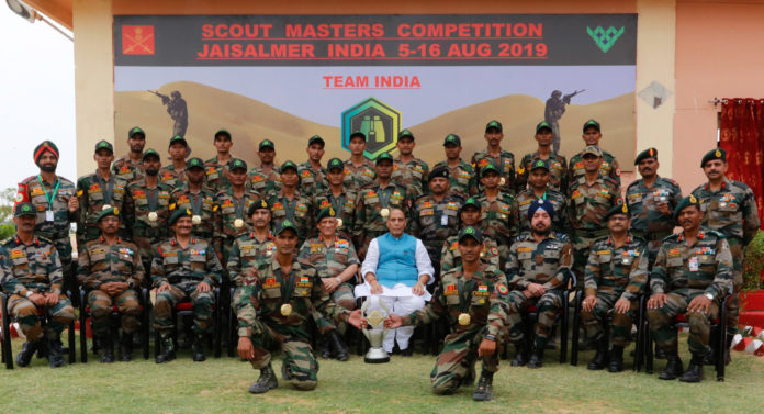 The Union Minister for Defence, Shri Rajnath Singh with the Indian Army contingent at the 5th International Army Scout Masters Competition 2019, at Jaisalmer, in Rajasthan on August 16, 2019. The Chief of Army Staff, General Bipin Rawat is also seen.