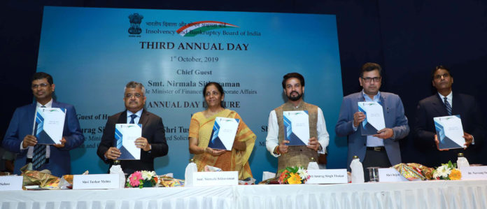 The Union Minister for Finance and Corporate Affairs, Smt. Nirmala Sitharaman releasing the publication, at the third Annual Day of Insolvency and Bankruptcy Board of India (IBBI), in New Delhi on October 01, 2019. The Minister of State for Finance and Corporate Affairs, Shri Anurag Singh Thakur, the Secretary, Ministry of Corporate Affairs, Shri Injeti Srinivas and other dignitaries are also seen.