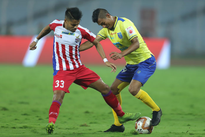 ATK's Prabir Das and KBFC's Halicharan Narzary vie for the ball in their Hero ISL clash today