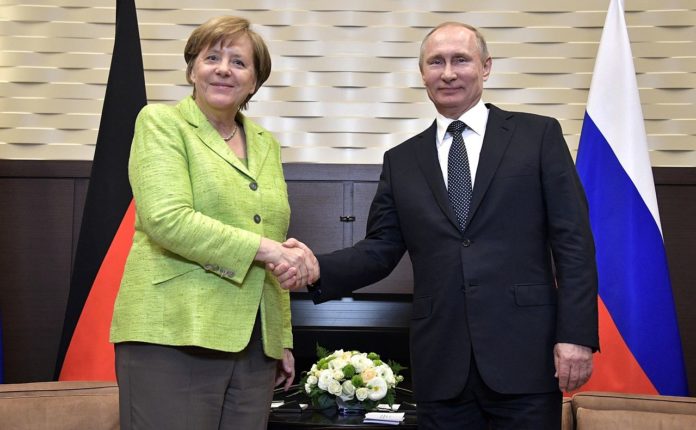 Russian President Vladimir Putin and Federal Chancellor of the Federal Republic of Germany Angela Merkel