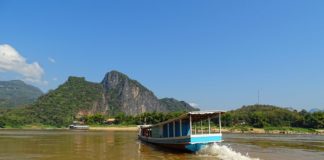 The Mekong River upstream from Luang Prabang, Laos. Boats like this one ferry passengers between Luang Prabang and the Pak Ou Caves.Photo by Wikipedia
