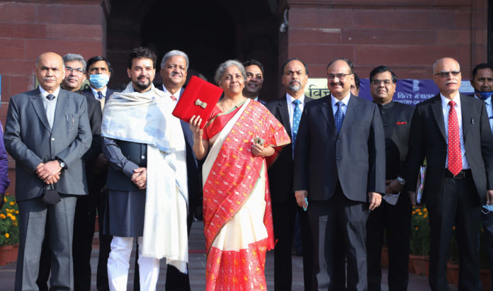 The Union Minister for Finance and Corporate Affairs, Smt. Nirmala Sitharaman departs from North Block to Rashtrapati Bhavan and Parliament House, along with the Minister of State for Finance and Corporate Affairs, Shri Anurag Singh Thakur and the senior officials to present the General Budget 2021-22, in New Delhi on February 01, 2021.