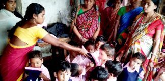 MWCD invites proposals for undertaking Research Studies/ Projects on welfare and development of Women and Children Anganwadi worker distributing dresses to children
