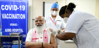 করোনা টিকা সম্পর্কে সচেতনতা সৃষ্টির লক্ষ্যে দেশব্যাপী “জান হ্যায়, তো জাঁহান হ্যায়” কর্মসূচির সূচনা The Prime Minister, Shri Narendra Modi took his first dose of the COVID-19 vaccine, at AIIMS, New Delhi on March 01, 2021.