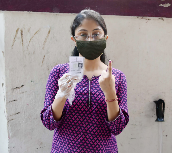 A female voter showing mark of indelible ink after casting her vote, at a polling booth, during the fourth phase of the West Bengal Assembly Election, in Santoshpur, Kolkata, West Bengal on April 10, 2021.