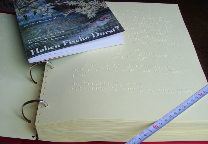Braille book and the same book in ink print by Wikipedia