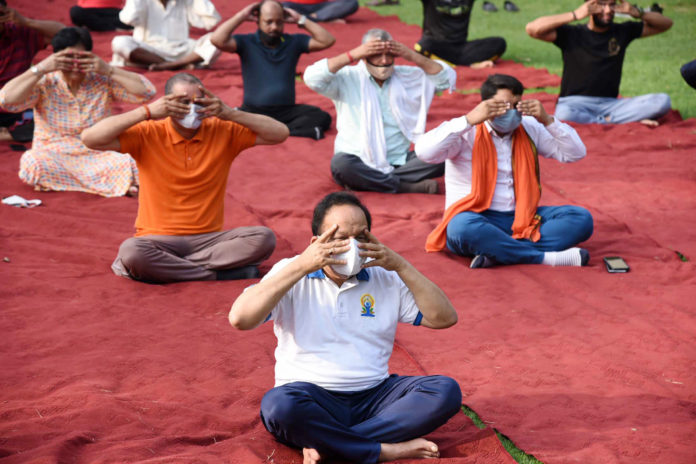 The Union Minister for Health & Family Welfare, Science & Technology and Earth Sciences, Dr. Harsh Vardhan performing Yoga, on the occasion of the 7th International Day of Yoga 2021, at Maharaja Agrasen Park, Kashmere Gate, Delhi on June 21, 2021.