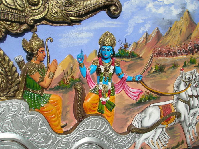 Krishna teaching Arjuna, from Bhagavata Gita, House decoration in Bishnupur, West Bengal, India. Image by Wikipedia