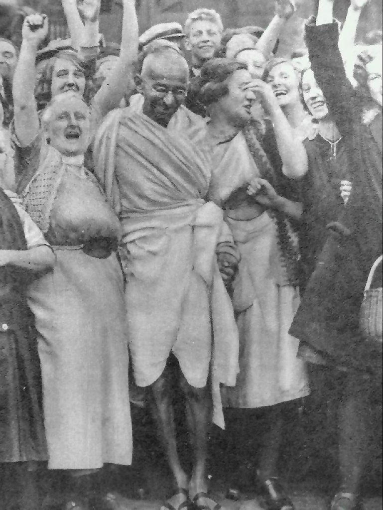Mahatma Gandhi with textile workers at Darwen, Lancashire, England, September 26, 1931. by Wikipedia