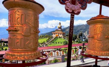 Buddhism and Humanism: The Universal Path to Peace, Compassion and Human Dignity Lord Buddha with Prayer Wheels