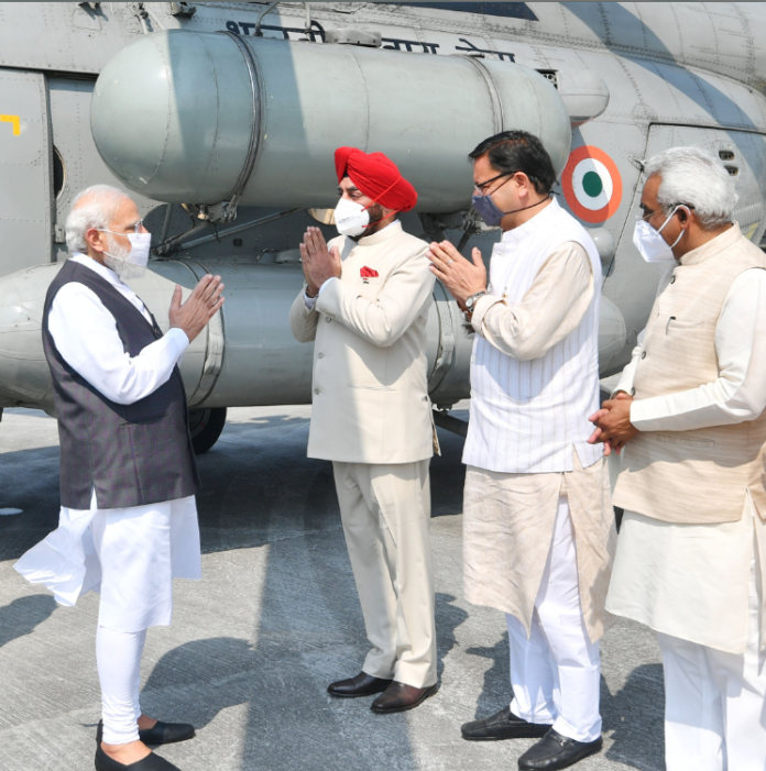 The Prime Minister, Shri Narendra Modi being received by the Governor of Uttarakhand, Lt. Gen. (Retd.) Shri Gurmit Singh and the Chief Minister of Uttarakhand, Shri Pushkar Singh Dhami, on his arrival at Rishikesh, Uttarakhand on October 07, 2021.