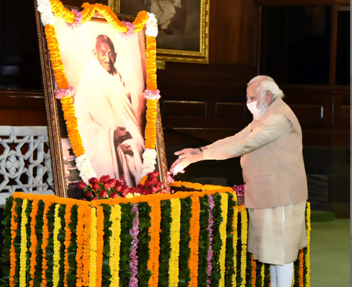The Prime Minister, Shri Narendra Modi paying tributes to Mahatma Gandhi on his 152nd birth anniversary, at Parliament House, in New Delhi on October 02, 2021