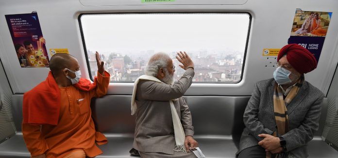 The Prime Minister, Shri Narendra Modi traveling in Kanpur Metro, Uttar Pradesh on December 28, 2021. The Union Minister for Petroleum & Natural Gas, Housing and Urban Affairs, Shri Hardeep Singh Puri and the Chief Minister of Uttar Pradesh, Yogi Adityanath are also seen.